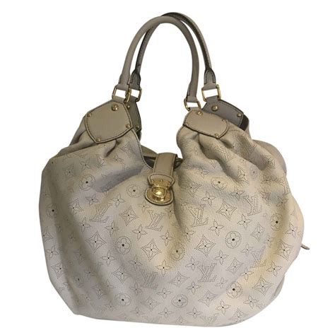 louis vuitton creme bag|Louis Vuitton mahina bag.